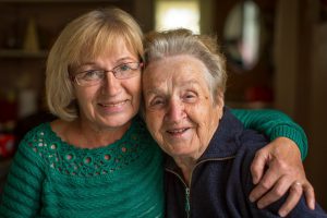 Grown woman with her old mother.